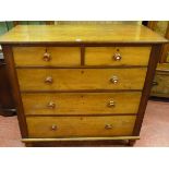 A 19th CENTURY OAK & MAHOGANY CHEST having two short over three long drawers with turned tigerwood