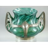 AN ART NOUVEAU LOETZ TYPE VASE in green twisted form and semi-iridescent, moulded within a pewter