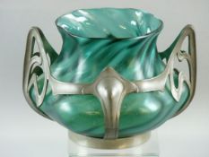 AN ART NOUVEAU LOETZ TYPE VASE in green twisted form and semi-iridescent, moulded within a pewter