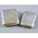 A LADY'S SILVER CIGARETTE CASE with all over scrolled decoration, 1.8 ozs, Birmingham 1915 and a