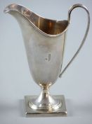 A SQUARE BASED PLAIN SILVER HELMET CREAM JUG, inscribed with the letter 'J', 3.6 ozs, Sheffield