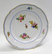 A NANTGARW PORCELAIN PLATE of lobed form with four internal sprays of flowers to the interior and