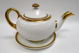 SWANSEA PORCELAIN TEAPOT & STAND having a round, squat body with Paris fluting, tapering handle with