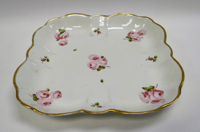 A SWANSEA PORCELAIN SQUARE DISH of rounded and fluted form with gilded rim and painted with pink - Image 2 of 2
