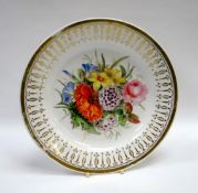 A SWANSEA PORCELAIN PLATE decorated with a large spray of flowers to the interior and with gilding
