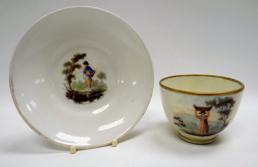 A RARE SWANSEA GLASSY PORCELAIN CUP & SAUCER DECORATED BY WILLIAM BILLINGSLEY, with a single