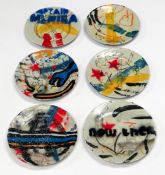 NEALE HOWELLS mixed media on ceramic - six small plates decorated in the graffiti style, 17cms