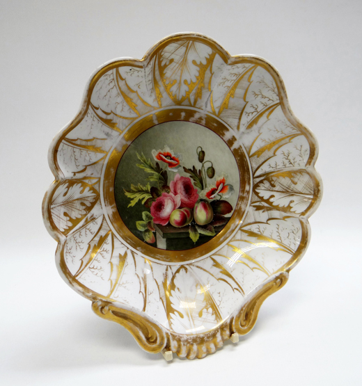 A SHELL SHAPED DISH of lobed form and with profuse gilding, the interior painted with a