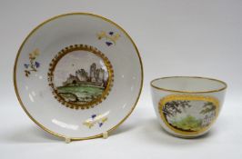 A PINXTON PORCELAIN CUP & SAUCER, the saucer decorated with a scene entitled ‘Caerphilly Castle,