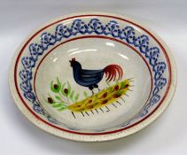 A RARE LLANELLY POTTERY ‘COCKEREL’ BASIN having a beaded rim and typically decorated in the manner