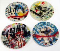 NEALE HOWELLS mixed media on ceramic - four large plates decorated in the graffiti style, 27cms diam