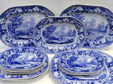 A SET OF SIXTEEN CAMBRIAN POTTERY ‘CATTLE CROSSING STREAM’ PLATTERS in blue and white, each with