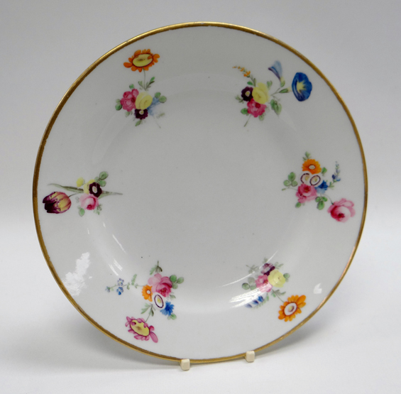 SWANSEA PORCELAIN PLATE of circular form with gilded rim and painted sprays of flowers, impressed