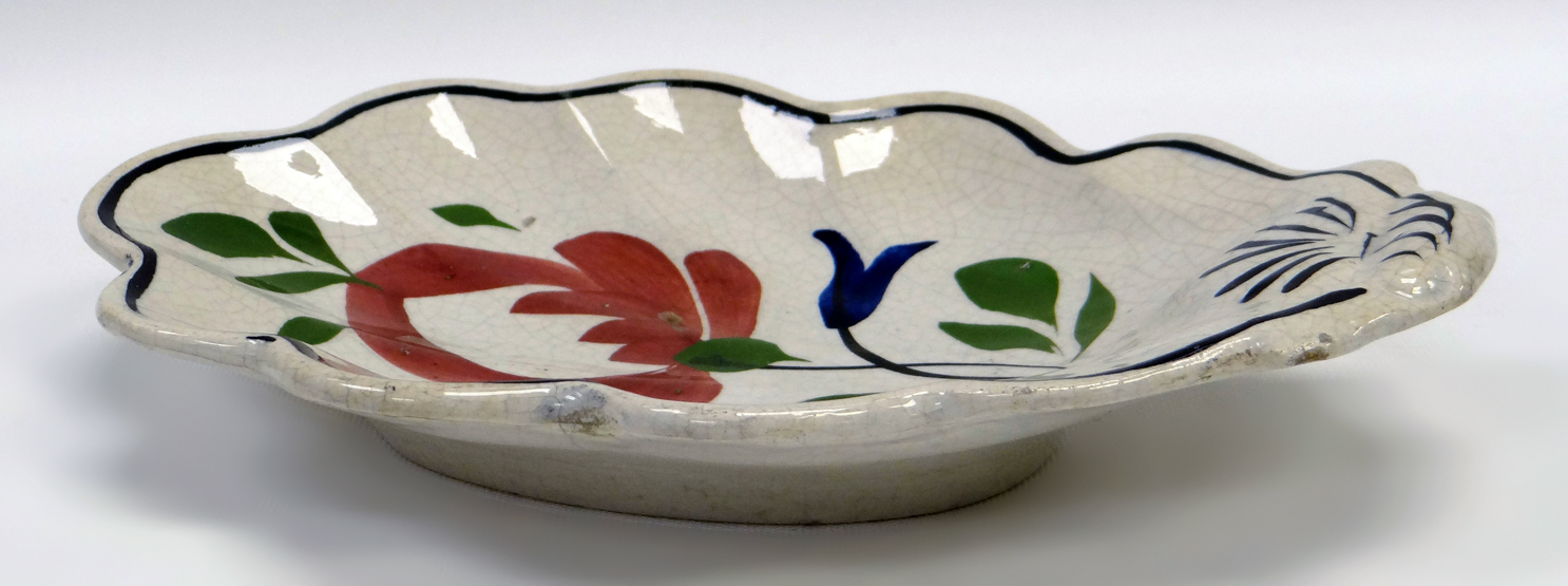 A LLANELLY POTTERY DISH of acorn-leaf shape, painted with a stylised flowers with leaves, - Image 2 of 2