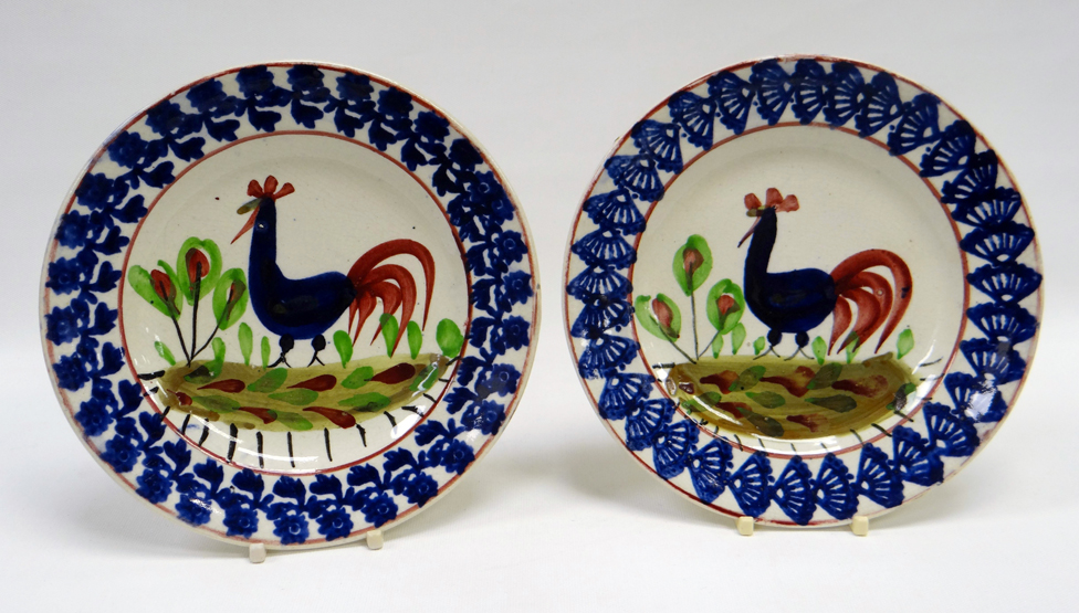 A PAIR OF LLANELLY POTTERY ‘COCKEREL’ TEA PLATES in good bold sponged colours, possibly by Sarah