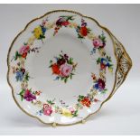 A NANTGARW PORCELAIN SHELL SHAPED DISH decorated with a continuous band of flowers to the border and