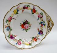 A NANTGARW PORCELAIN SHELL SHAPED DISH decorated with a continuous band of flowers to the border and