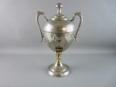 A VICTORIAN TEA SAMOVAR in a pewter tone with bright cut and reeded decoration, twin handled with