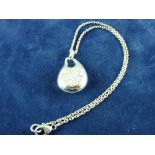 A 925 SILVER NECK CHAIN AND PENDANT having a flower of tiny diamonds, 21.5 grms total