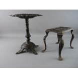 TWO VICTORIAN CAST IRON STANDS, a circular topped example with heart and floral top on a column