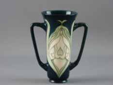 A MOORCROFT 'COLLECTOR'S CLUB' TWIN HANDLED VASE, Art Nouveau style tube line pattern on a blue/