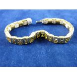 A GOLD AND DIAMOND BRACELET, marked eighteen carat, Italy and having forty eight round cut