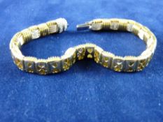 A GOLD AND DIAMOND BRACELET, marked eighteen carat, Italy and having forty eight round cut