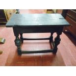 A JACOBEAN STYLE RUSTIC OAK TABLE with peg joint rectangular two plank top on carved and turned