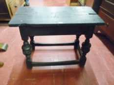 A JACOBEAN STYLE RUSTIC OAK TABLE with peg joint rectangular two plank top on carved and turned