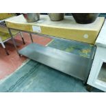 *A BUTCHER'S BLOCK, 150 x 50 cms set on a two tier stainless steel preparation table