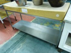 *A BUTCHER'S BLOCK, 150 x 50 cms set on a two tier stainless steel preparation table