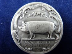 A NATIONAL PIG BREEDER'S MEDAL designed by H Maryon, awarded at the Royal Welsh Show, 1930 to Lord