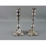 A PAIR OF SILVER CANDLESTICKS with detachable sconces, classically styled with multi-knop stems,