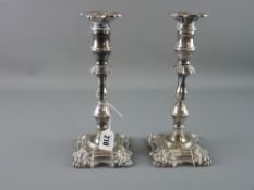 A PAIR OF SILVER CANDLESTICKS with detachable sconces, classically styled with multi-knop stems,