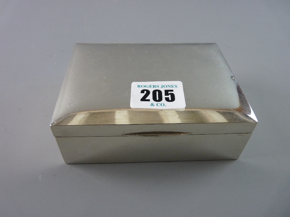 A HALLMARKED SILVER LIDDED CIGARETTE BOX, 11.5 cms across, Birmingham 1978, (one or two small