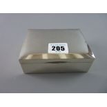 A HALLMARKED SILVER LIDDED CIGARETTE BOX, 11.5 cms across, Birmingham 1978, (one or two small