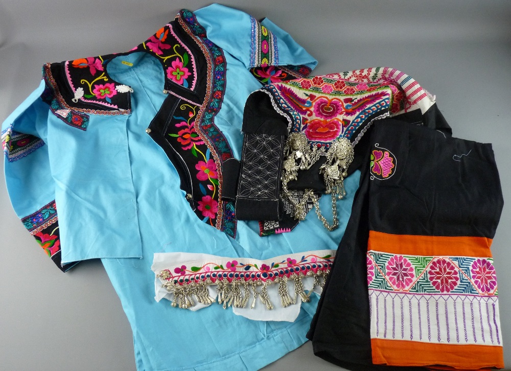 CHINESE COSTUME - a four piece lady's outfit from the Yi Ethnic group, colourful fabrics adorned