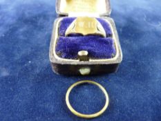 A NINE CARAT GOLD GENT'S SIGNET RING, 4 grms and a narrow unmarked wedding band, 2 grms