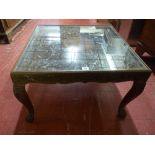 A 20th CENTURY CARVED INDIAN HARDWOOD COFFEE TABLE, circular centre top with excellent leaf carved
