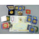 COMMEMORATIVE COINS AND MEDALLIONS to include fourteen, twenty two carat gold plated medallions,