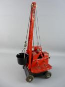 A TRIANG JONES KL44 CRANE, red and black livery, completely rigged with hook and bucket, 45 cms high