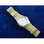 AN EIGHTEEN CARAT GOLD LADY'S OR GENT'S OMEGA CONSTELLATION CALENDAR WRISTWATCH with incorporated