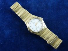 AN EIGHTEEN CARAT GOLD LADY'S OR GENT'S OMEGA CONSTELLATION CALENDAR WRISTWATCH with incorporated