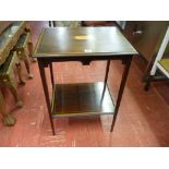 AN EDWARDIAN INLAID MAHOGANY TWO TIER SIDE TABLE having a central Sheraton fan inlay, boxwood