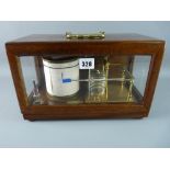 A TR LITTLE & CO BAROGRAPH, gilt brass on a mahogany stand with hinged case cover, glass three