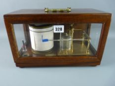 A TR LITTLE & CO BAROGRAPH, gilt brass on a mahogany stand with hinged case cover, glass three