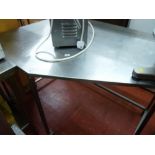 *A STAINLESS STEEL CORNER PREPARATION TABLE, maximum length 135 cms x 90 cms