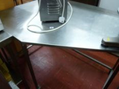 *A STAINLESS STEEL CORNER PREPARATION TABLE, maximum length 135 cms x 90 cms