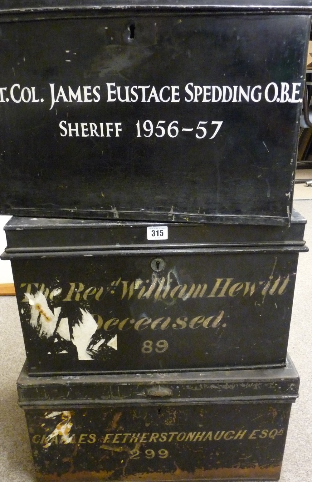 THREE VINTAGE METAL DEED BOXES, black painted with iron carry handles for the 'Reverend William