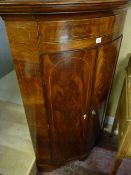 AN EXCELLENT LATE GEORGIAN INLAID MAHOGANY STANDING CORNER CUPBOARD, bow fronted with polished top